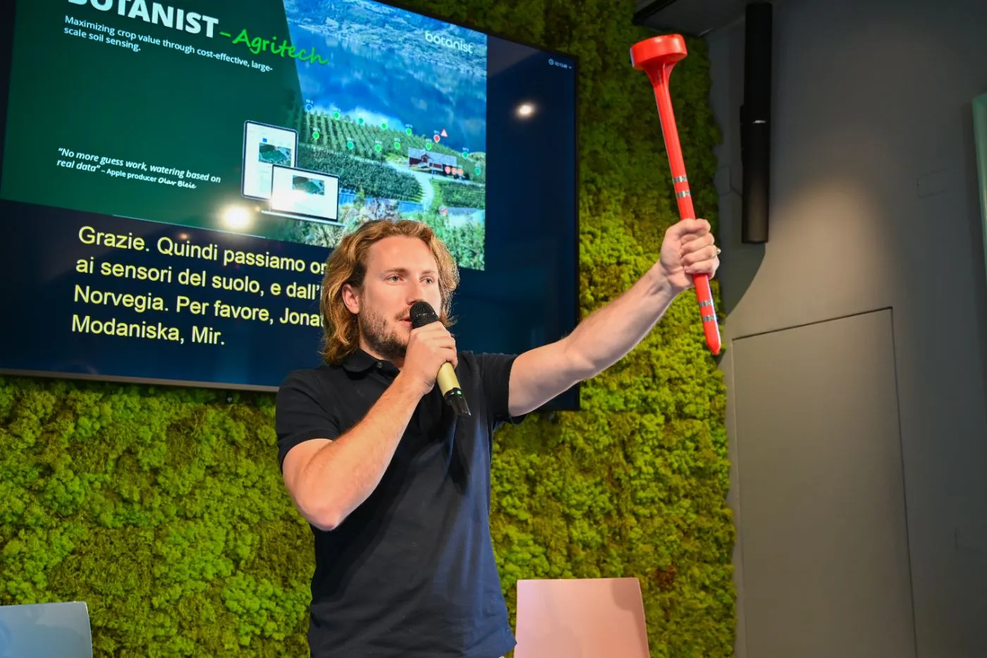The BOTanist founder shows the soil sensor during the pitch